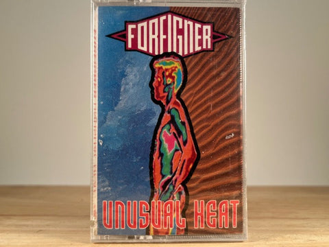 FOREIGNER – UNUSUAL HEAT – BRAND NEW CASSETTE TAPE [has saw mark]